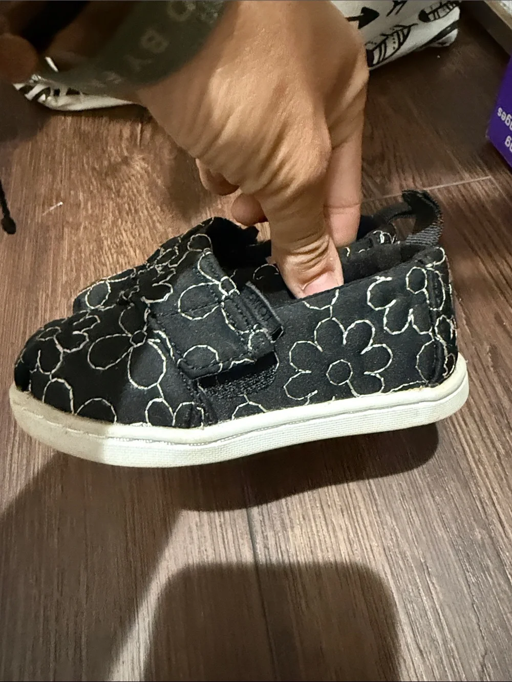 TOMS Kids Black Slip-On Shoes with White Floral Stitching